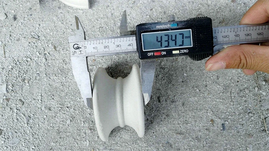 Ceramic Raschig rings being charged into sulfuric acid drying tower with proper dumping chute